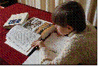 Child reading a book.